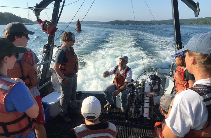 David Fields gives a lecture on the aft deck of an RV