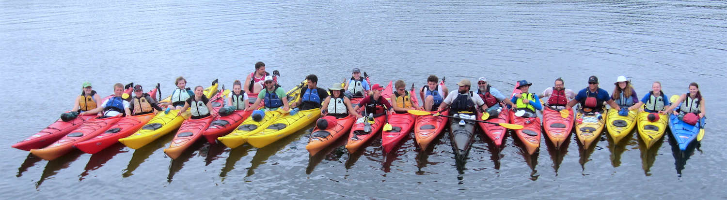 Students on kayaks in the water.