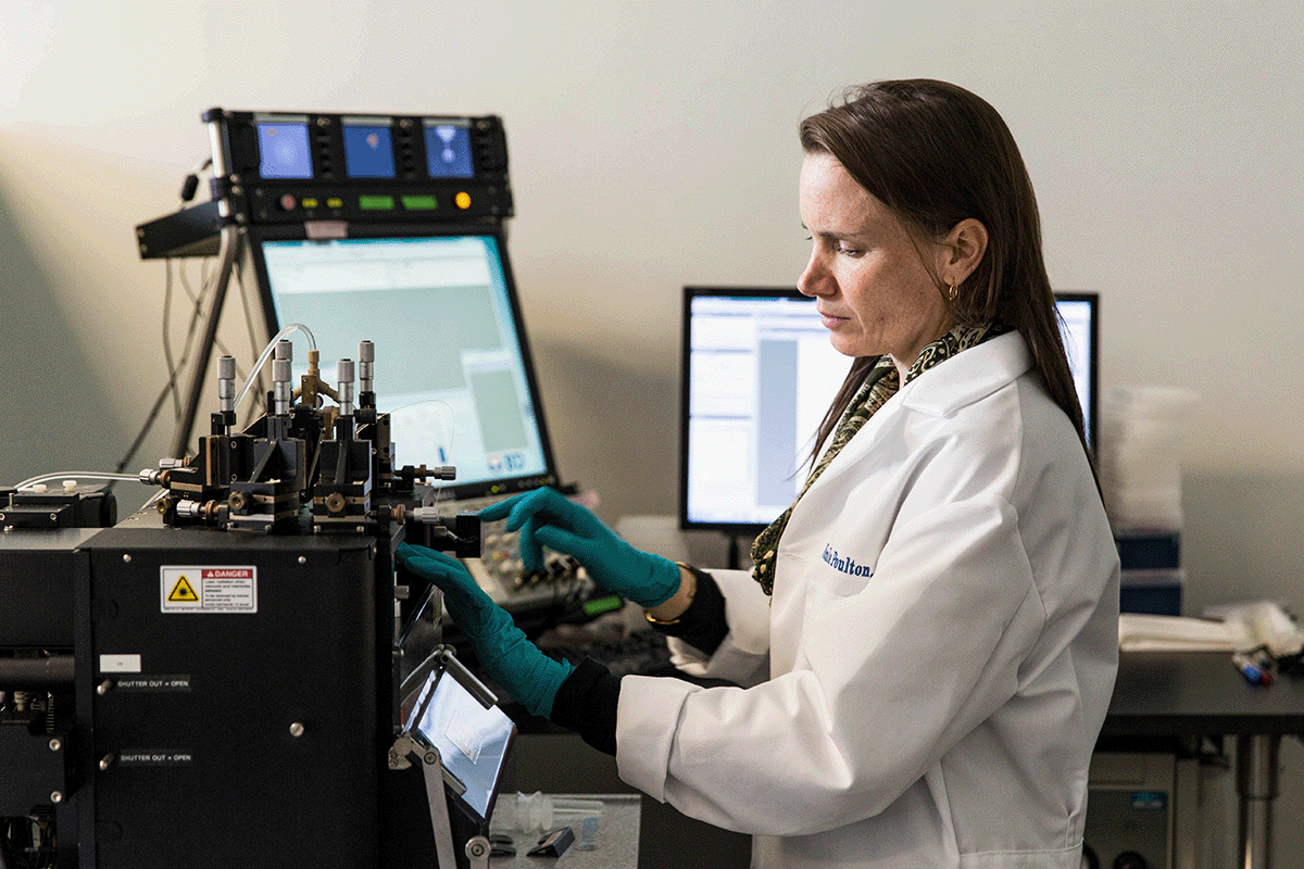 Senior Research Scientist Nicole Poulton operating a flow cytometer