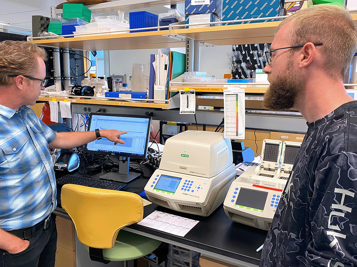 Pete Countway pointing at data displayed on a monitor