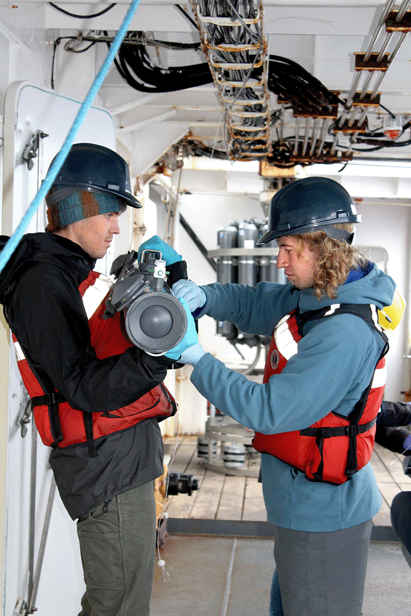 Colby College student TJ Guercio secures a water sample