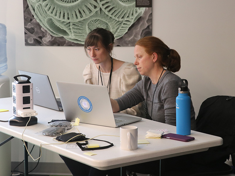 Research Scientist Julia Brown works with a student