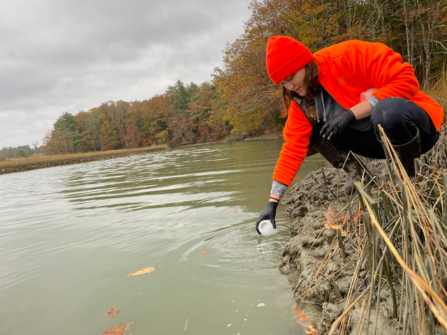 Research technician Caitlyn Olson collecting water samples