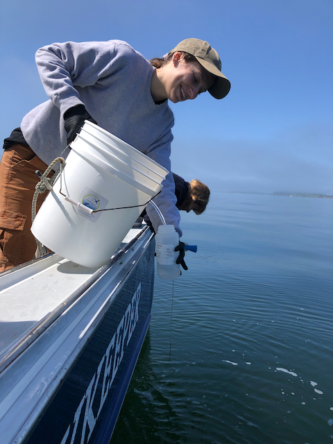 Erin Beirne collecting water samples