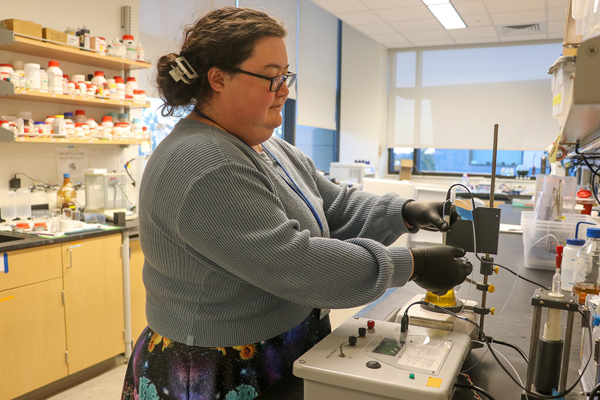 Research Scientist Melody Lindsay processes samples