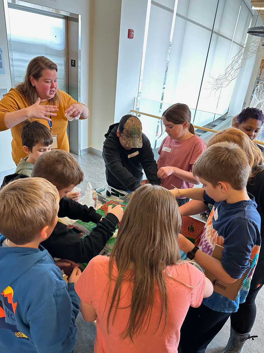 Senior Research Scientist Rachel Sipler with students