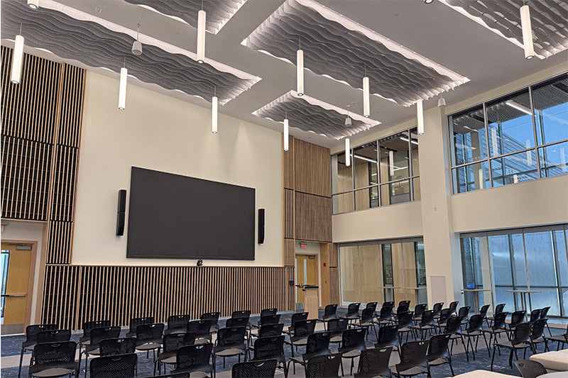 The Burgess Forum at Bigelow Labs. Chairs, large video screen, and architectural detail 