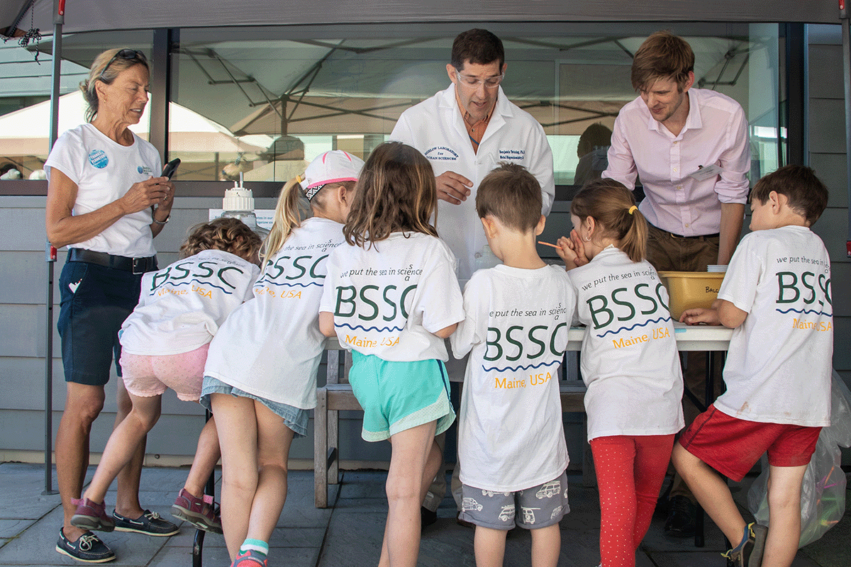 schoolchildren atytending a science demonstration klled by Sr. Research Scientists Ben Twining &amp; Christoph Aeppli