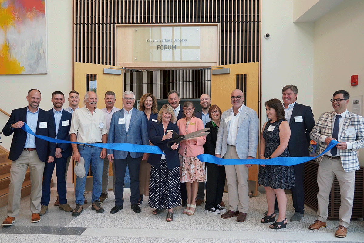 Group of people standing in front of the entrance to the Burgess FOrum at Bigelow's Grand Opening for the new Harold Alfond Center for Ocean Education and Innovation