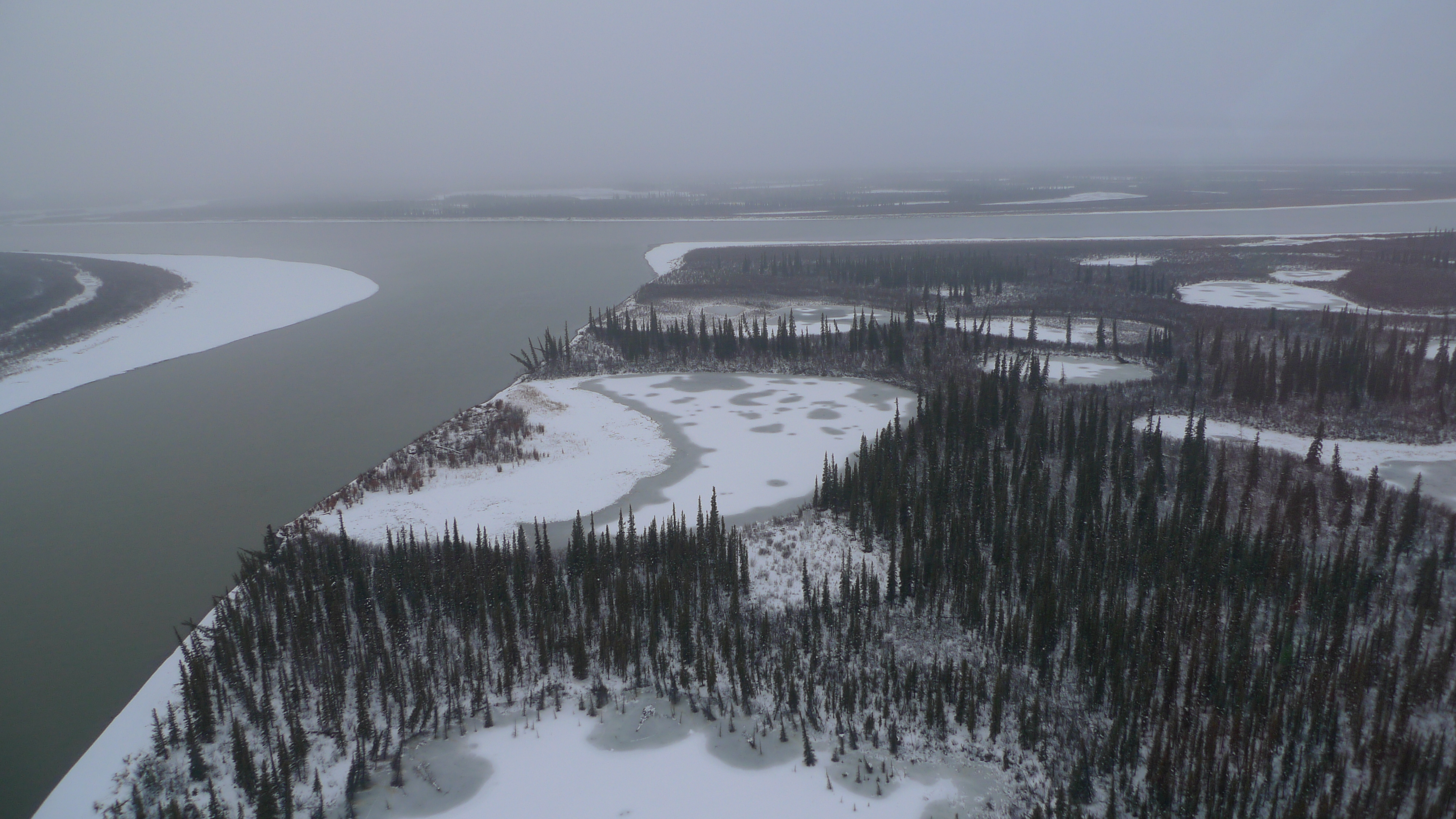 Arial view of lake during the winter.