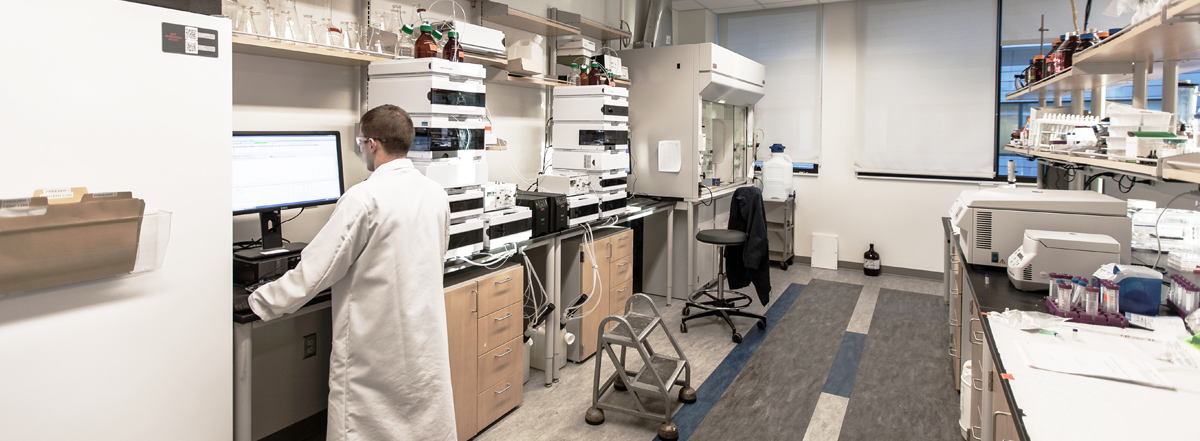 Senior Research Scientist Nichole Poulton Performing Flow Cytometry