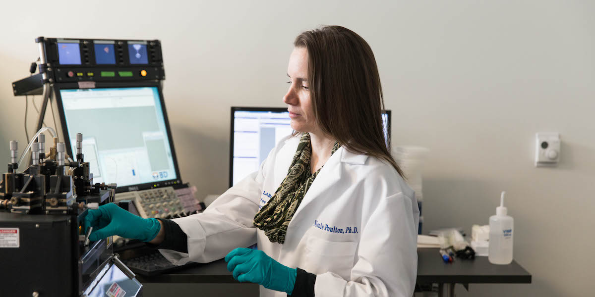 Scientist working with a lab instrument